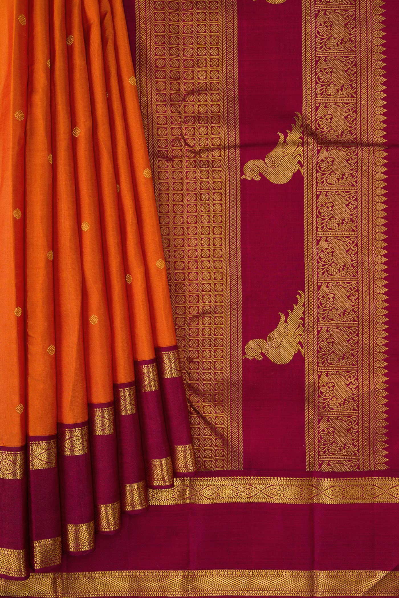 Pleats and pallu of Pure Silk Pure Zari Brick Orange Dual Tone Kanjivaram Saree with Zari Butta on the body and Zari Border. 