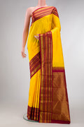 Pure Silk Pure Zari Yellow Dual Tone Kanjivaram Saree with Zari Butta on the body and Zari Border.  displayed on a mannequin