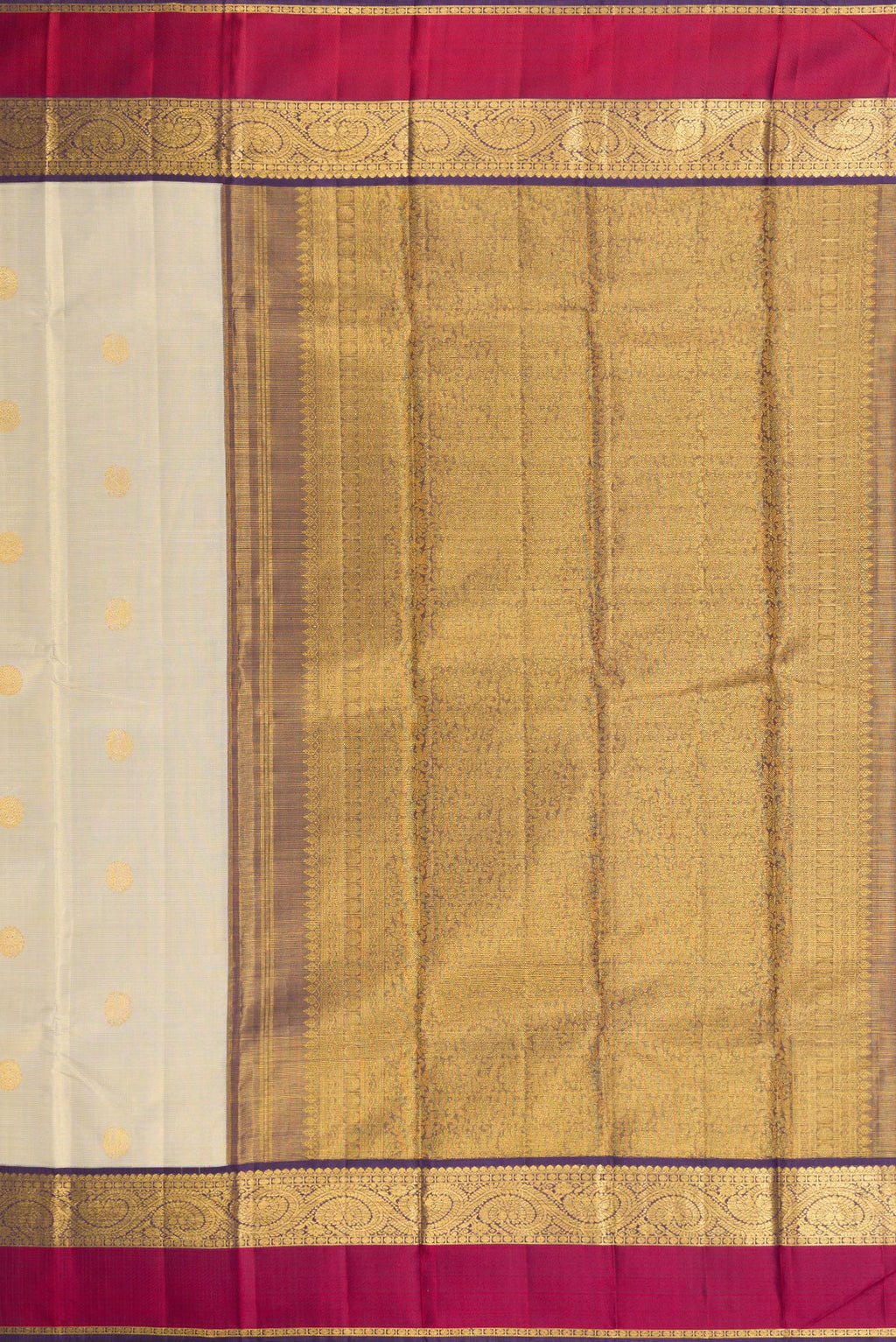 Close up image of the pallu of Beige Dual Tone Kanjivaram Silk Saree with Zari Butta on the body and Zari And Thread Border. 