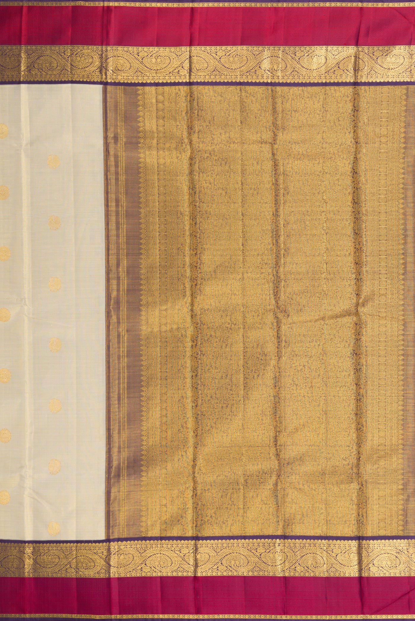 Close up image of the pallu of Beige Dual Tone Kanjivaram Silk Saree with Zari Butta on the body and Zari And Thread Border. 