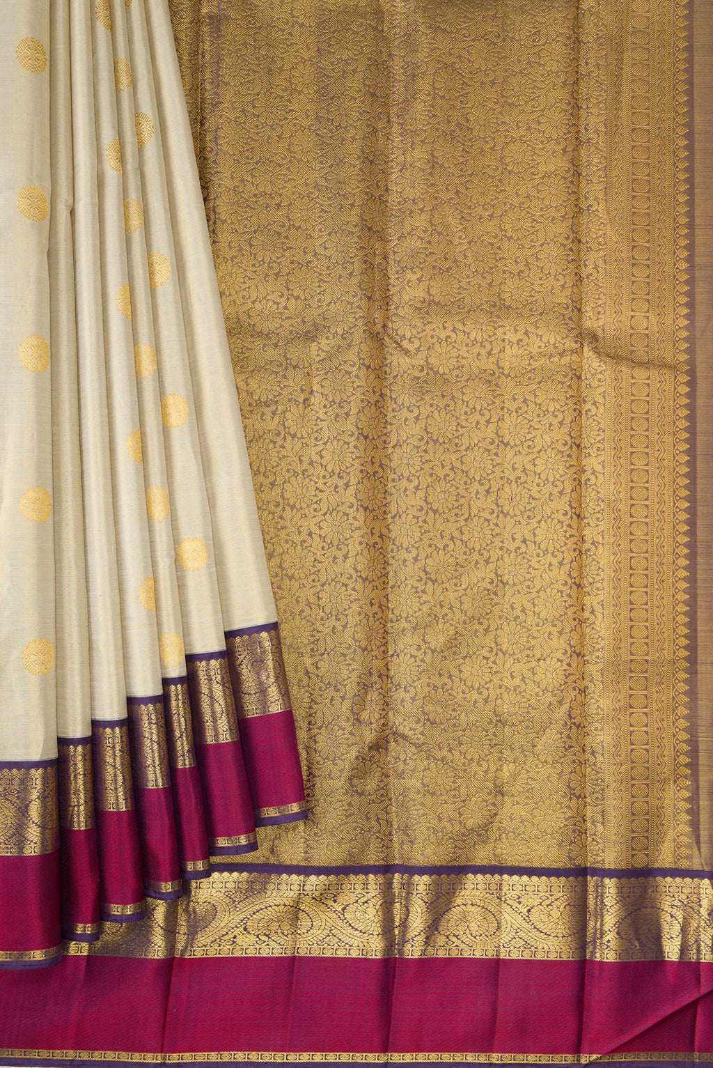 Pleats and pallu of Beige Dual Tone Kanjivaram Silk Saree with Zari Butta on the body and Zari And Thread Border. 