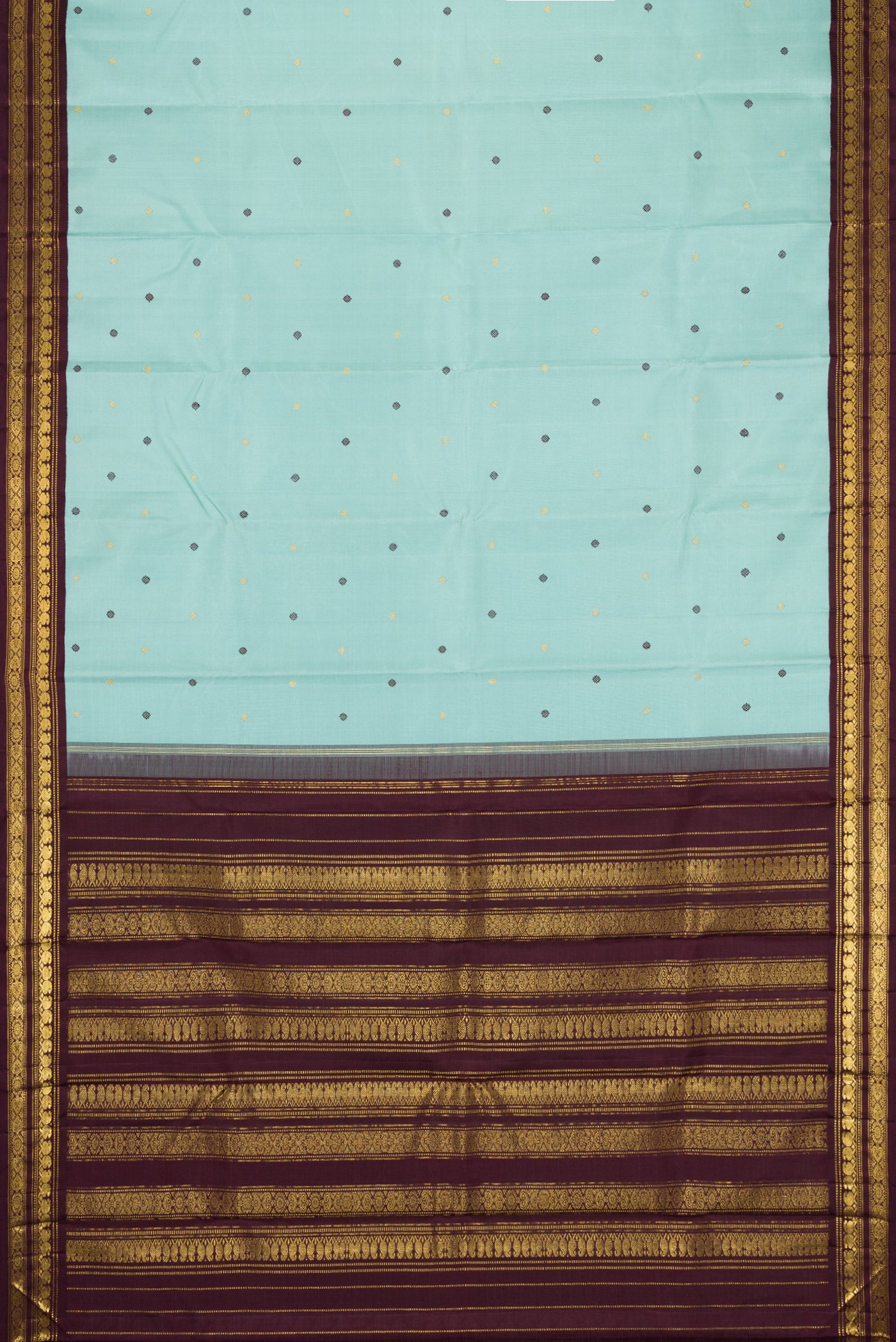 Flat view of Sky Blue Dual Tone Kanjivaram Silk Saree with Zari And Thread Butta on the body and Zari Border. 