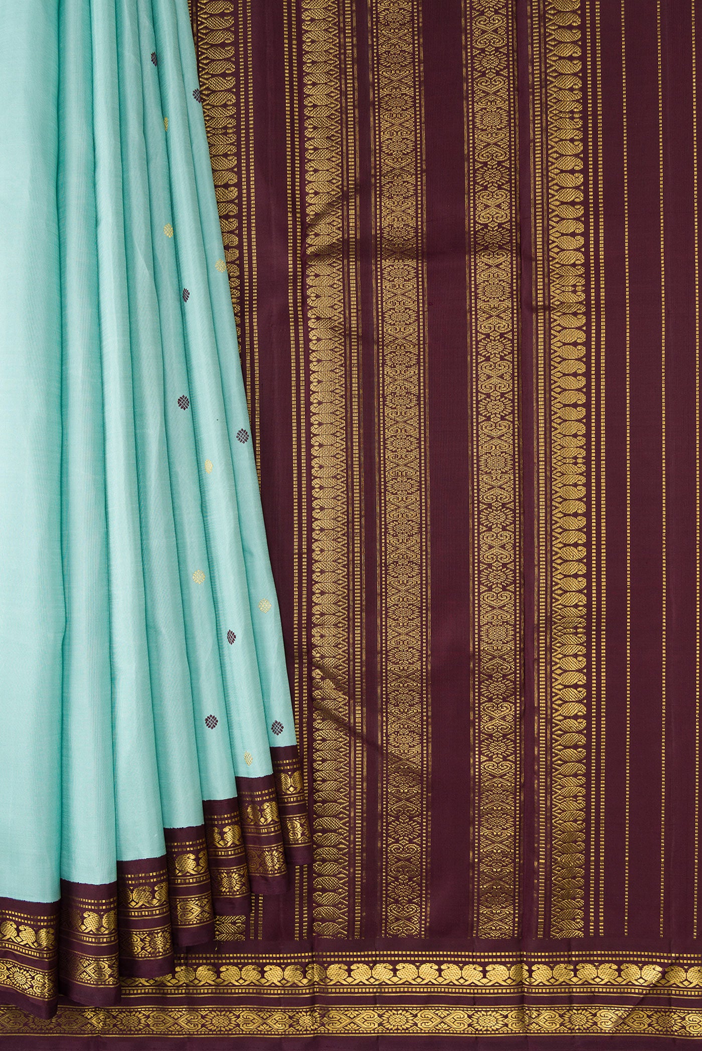 Pleats and pallu of Sky Blue Dual Tone Kanjivaram Silk Saree with Zari And Thread Butta on the body and Zari Border. 