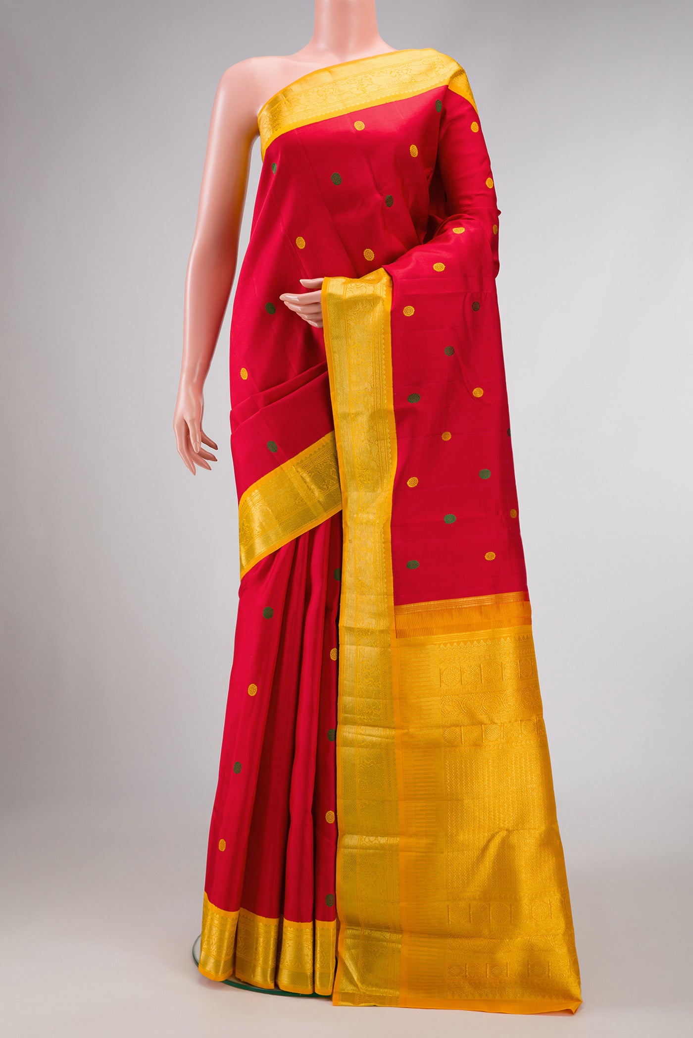 Pure Silk Pure Zari Deep Red Dual Tone Kanjivaram Saree with Thread Butta on the body and Zari Border.  displayed on a mannequin
