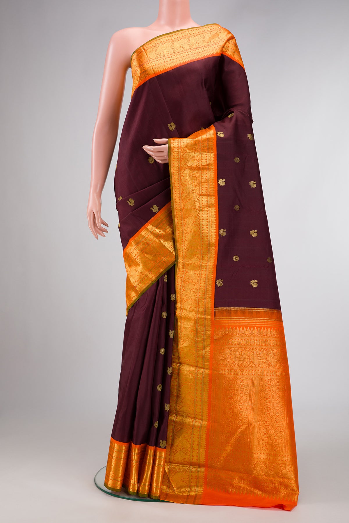 Coffee Brown Dual Tone Kanjivaram Silk Saree with Zari Butta on the body and Zari Border.  displayed on a mannequin