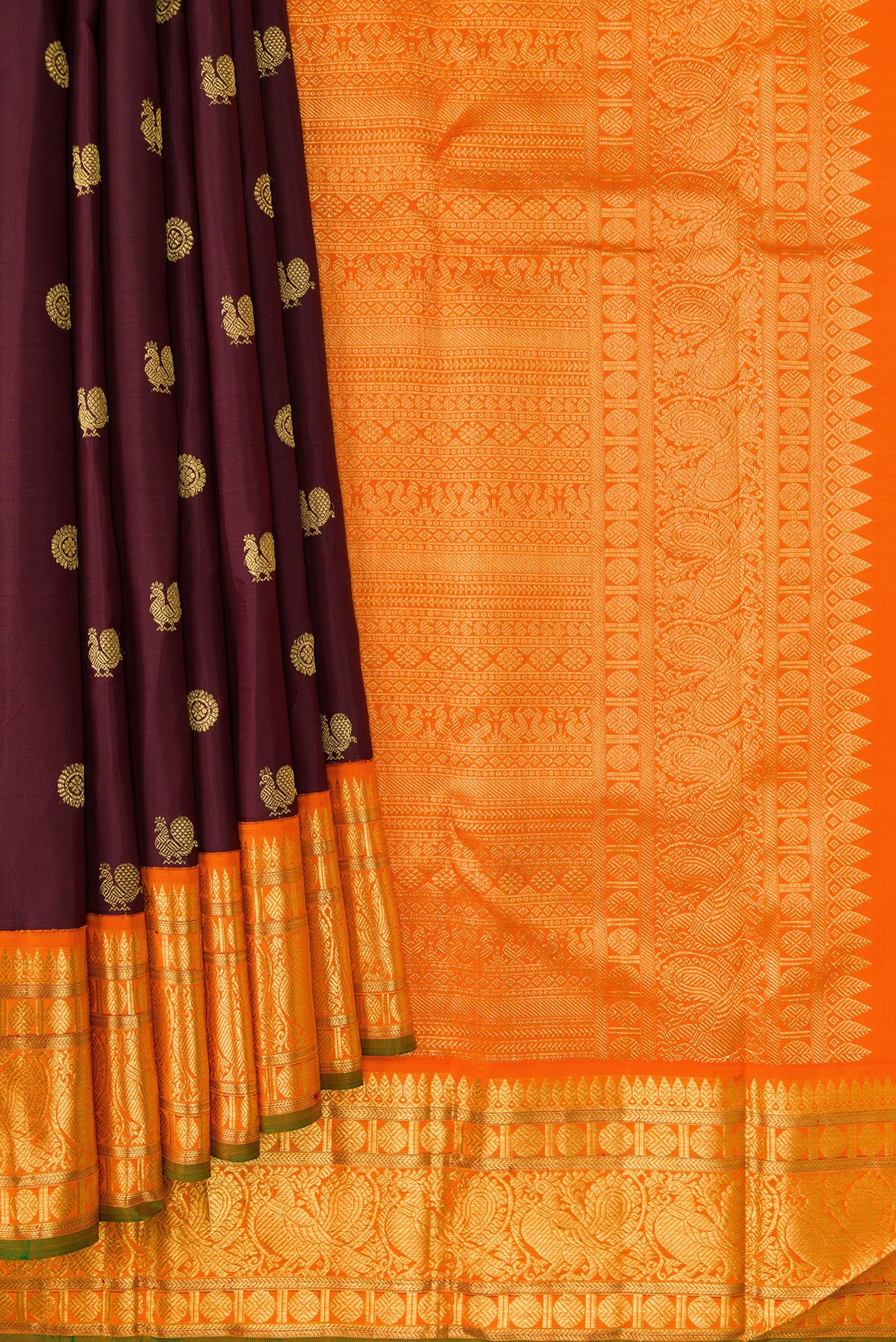 Pleats and pallu of Coffee Brown Dual Tone Kanjivaram Silk Saree with Zari Butta on the body and Zari Border. 