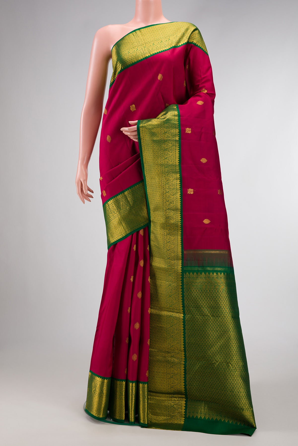 Pure Silk Pure Zari Maroon Dual Tone Kanjivaram Saree with Zari Butta on the body and Zari Border.  displayed on a mannequin