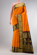 Mustard Dual Tone Kanjivaram Silk Saree with Zari Butta on the body and Zari Border.  displayed on a mannequin