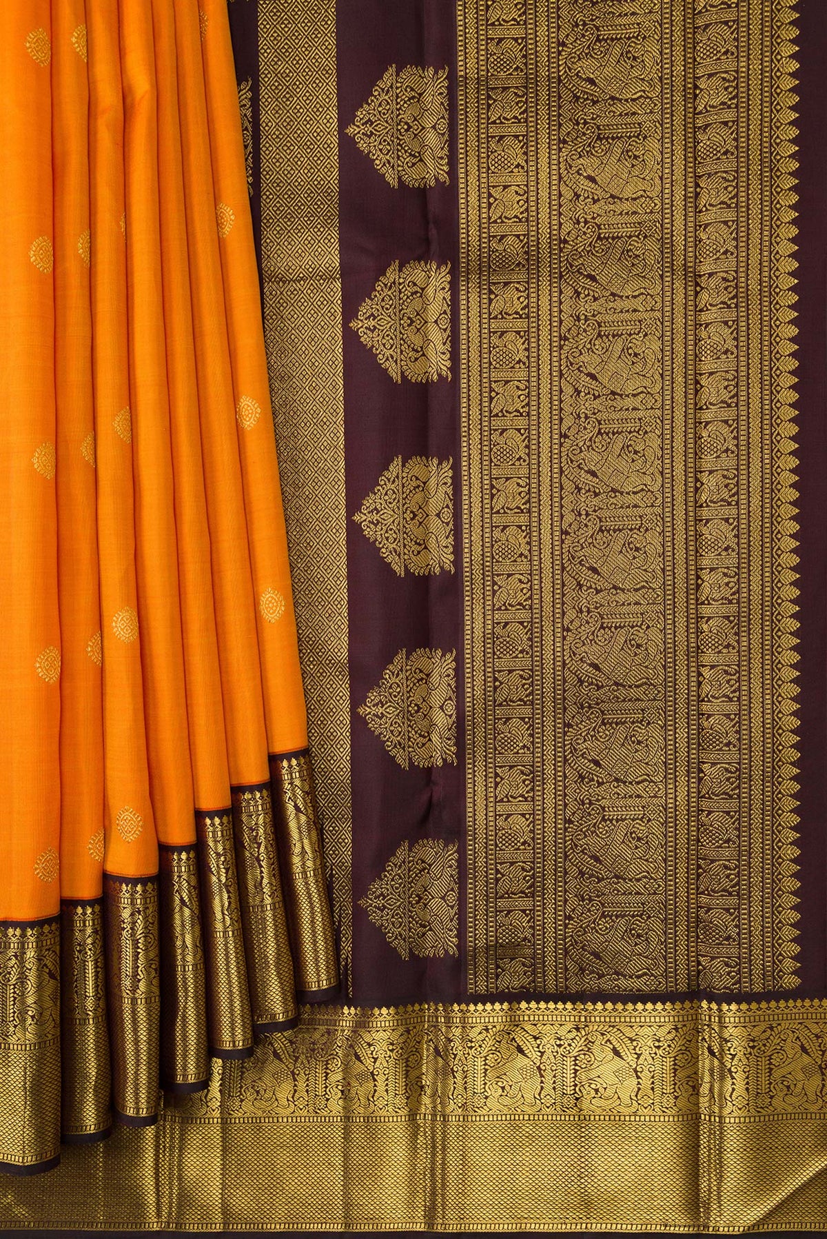 Pleats and pallu of Mustard Dual Tone Kanjivaram Silk Saree with Zari Butta on the body and Zari Border. 