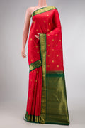 Red Dual Tone Kanchipuram Silk Saree with Zari Butta on the body and Zari Border.  displayed on a mannequin