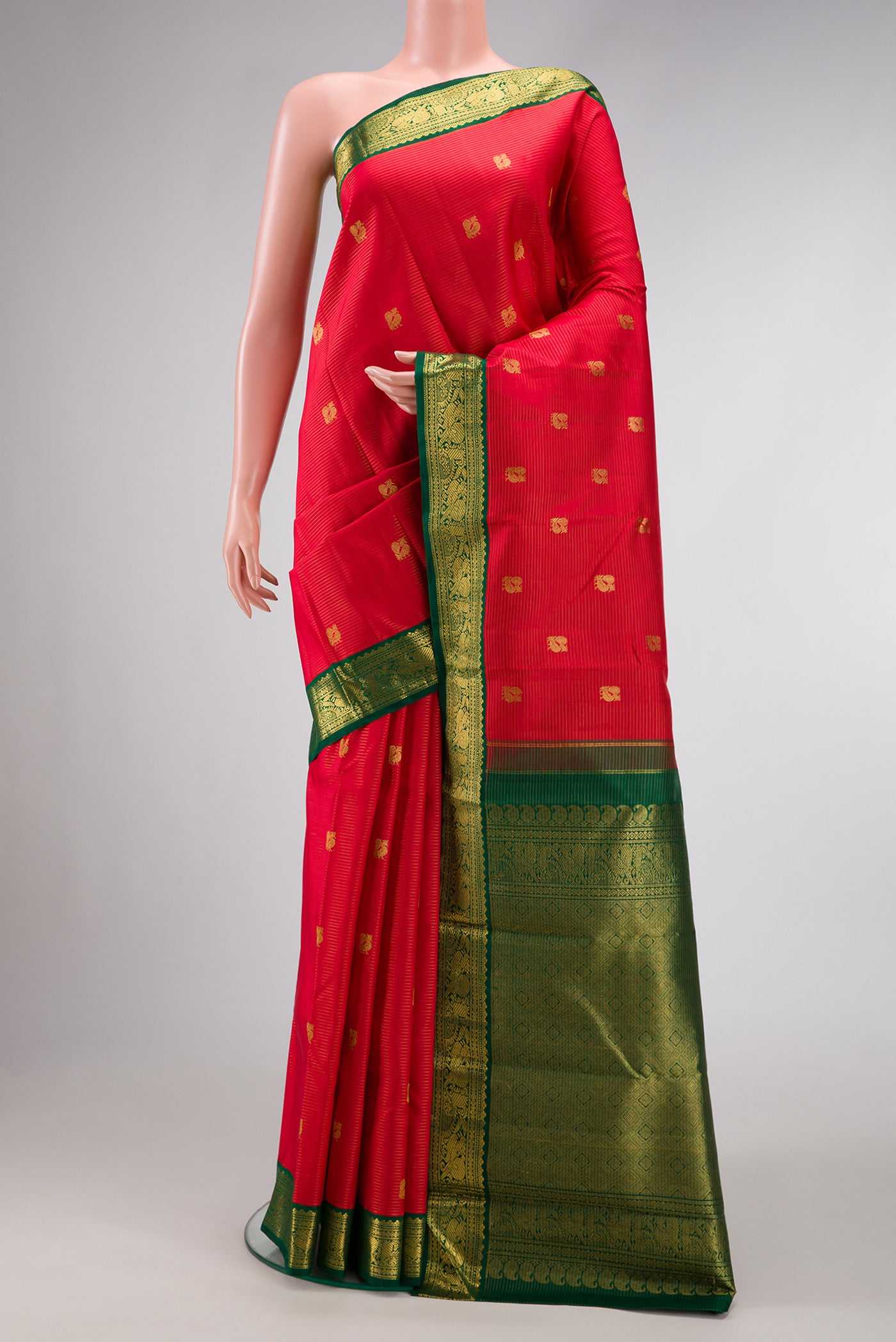 Red Dual Tone Kanchipuram Silk Saree with Zari Butta on the body and Zari Border.  displayed on a mannequin
