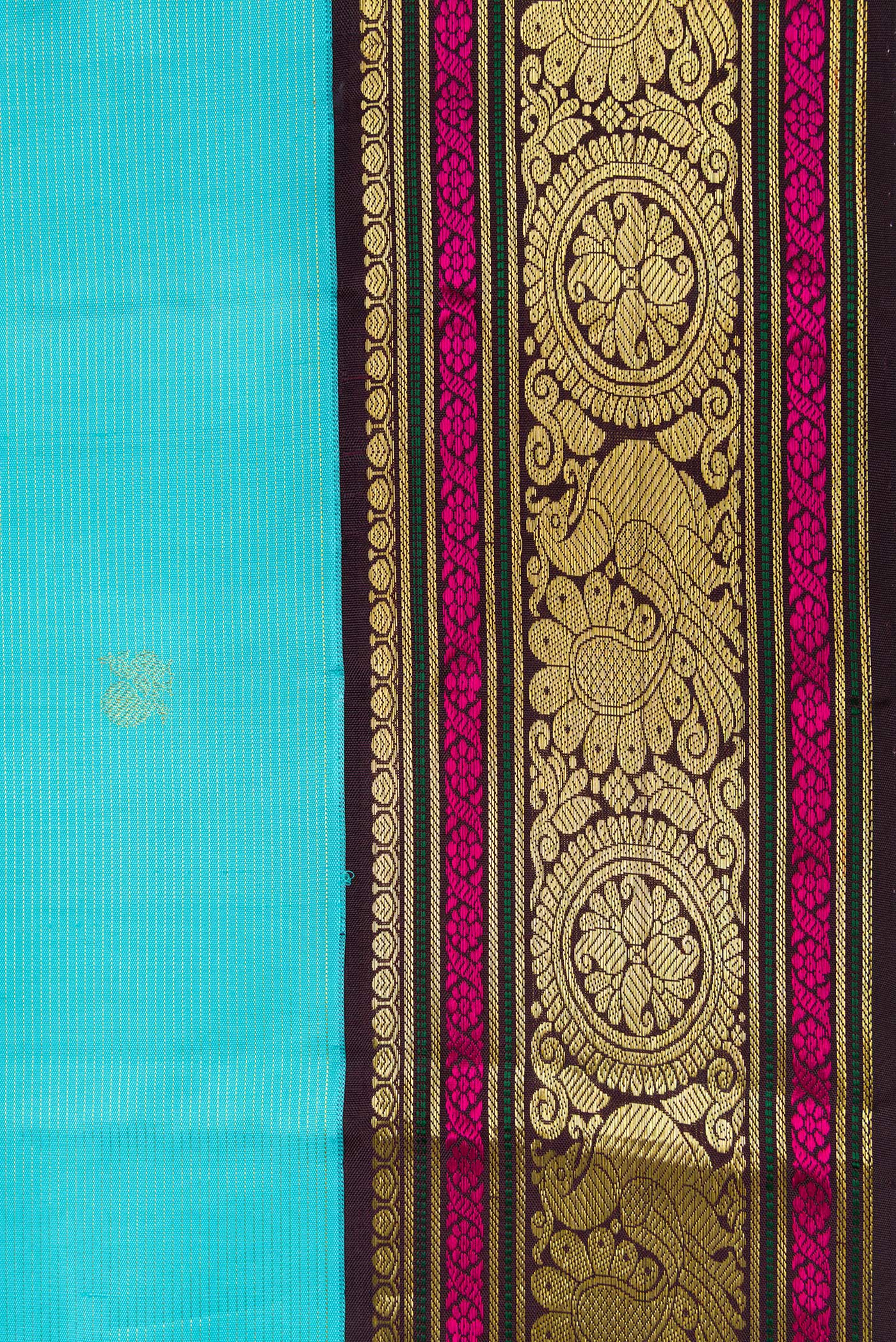 Border image of Sky Blue Dual Tone Kanchipuram Silk Saree with Zari Butta on the body and Zari And Thread Border. 