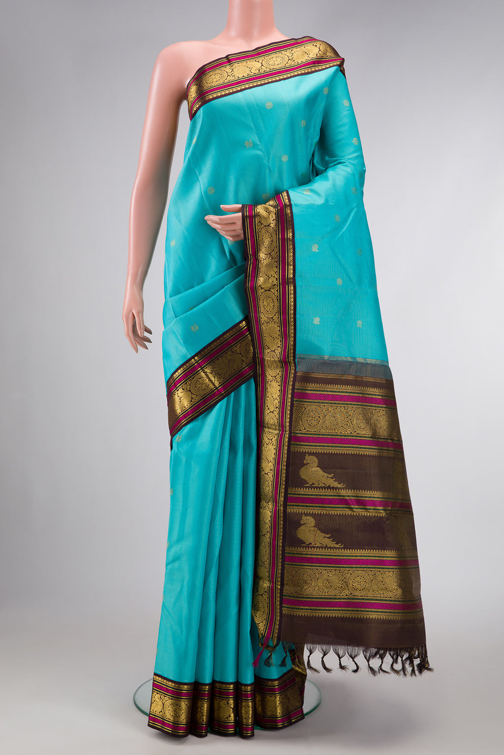 Sky Blue Dual Tone Kanchipuram Silk Saree with Zari Butta on the body and Zari And Thread Border.  displayed on a mannequin