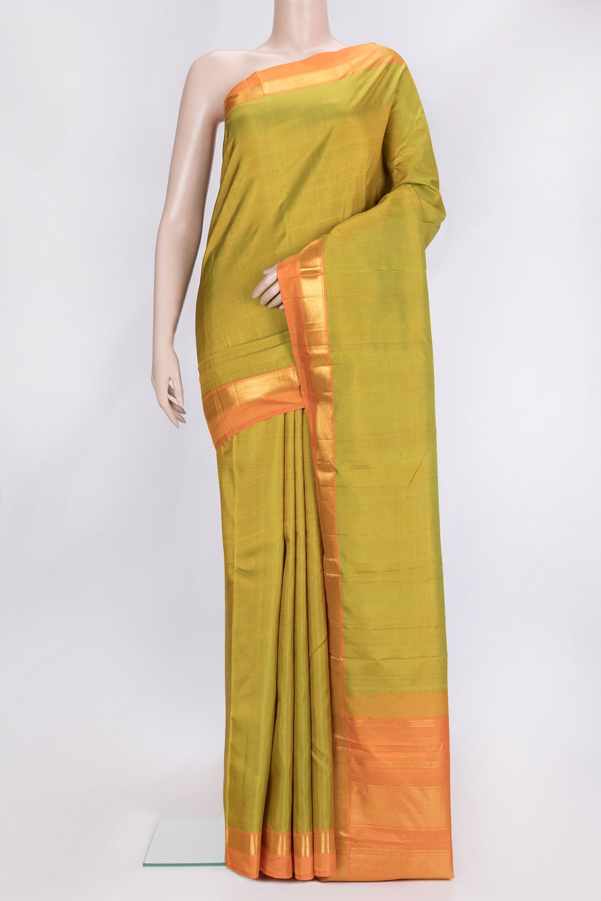 Parrot Green Dual Tone Kanjivaram Silk Saree with Plain Body and Zari Border.  displayed on a mannequin