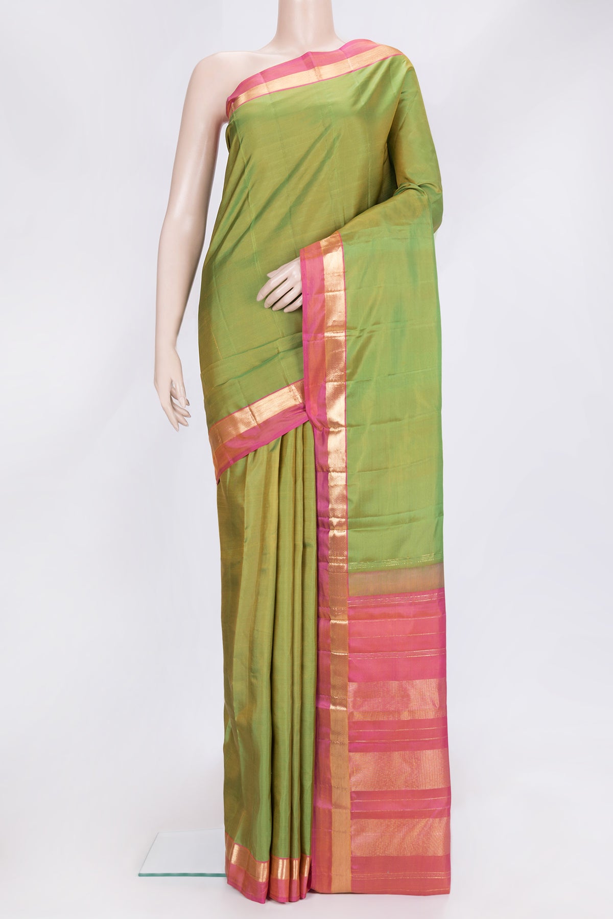 Parrot Green Dual Tone Kanjivaram Silk Saree with Plain Body and Zari Border.  displayed on a mannequin