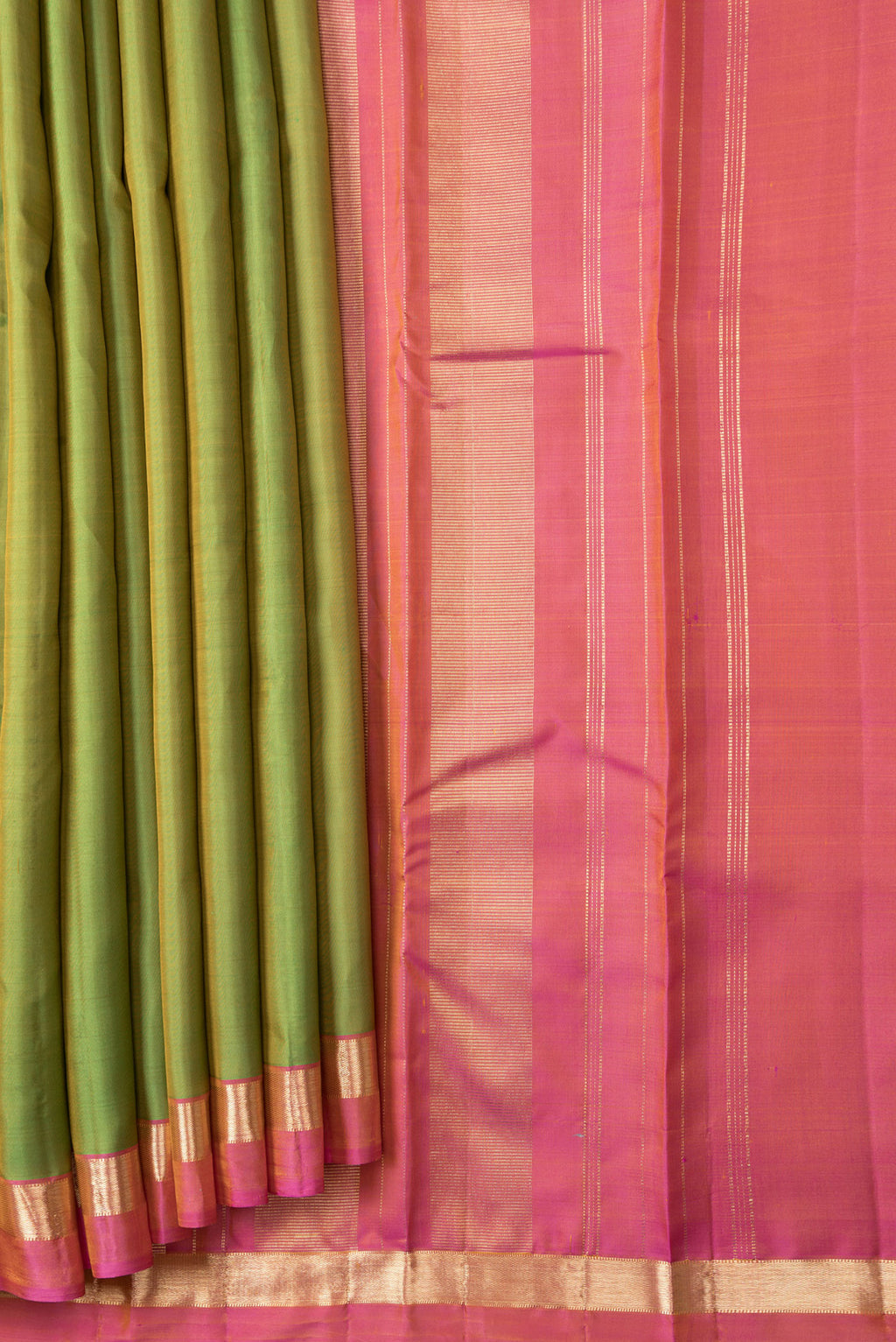Pleats and pallu of Parrot Green Dual Tone Kanjivaram Silk Saree with Plain Body and Zari Border. 