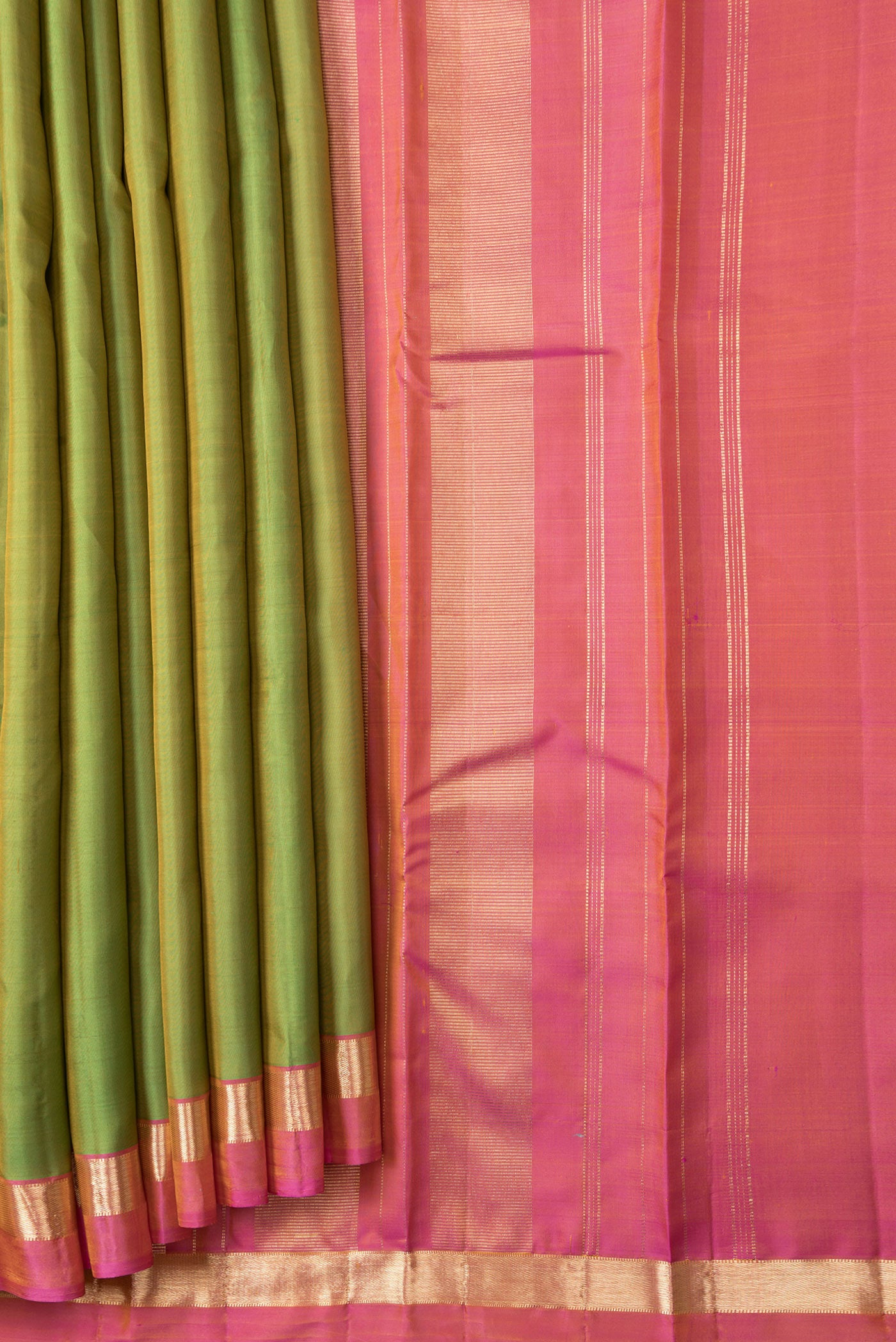 Pleats and pallu of Parrot Green Dual Tone Kanjivaram Silk Saree with Plain Body and Zari Border. 