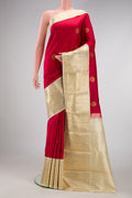 Maroon Dual Tone Kanjivaram Silk Saree with Zari Butta on the body and Zari Border.  displayed on a mannequin