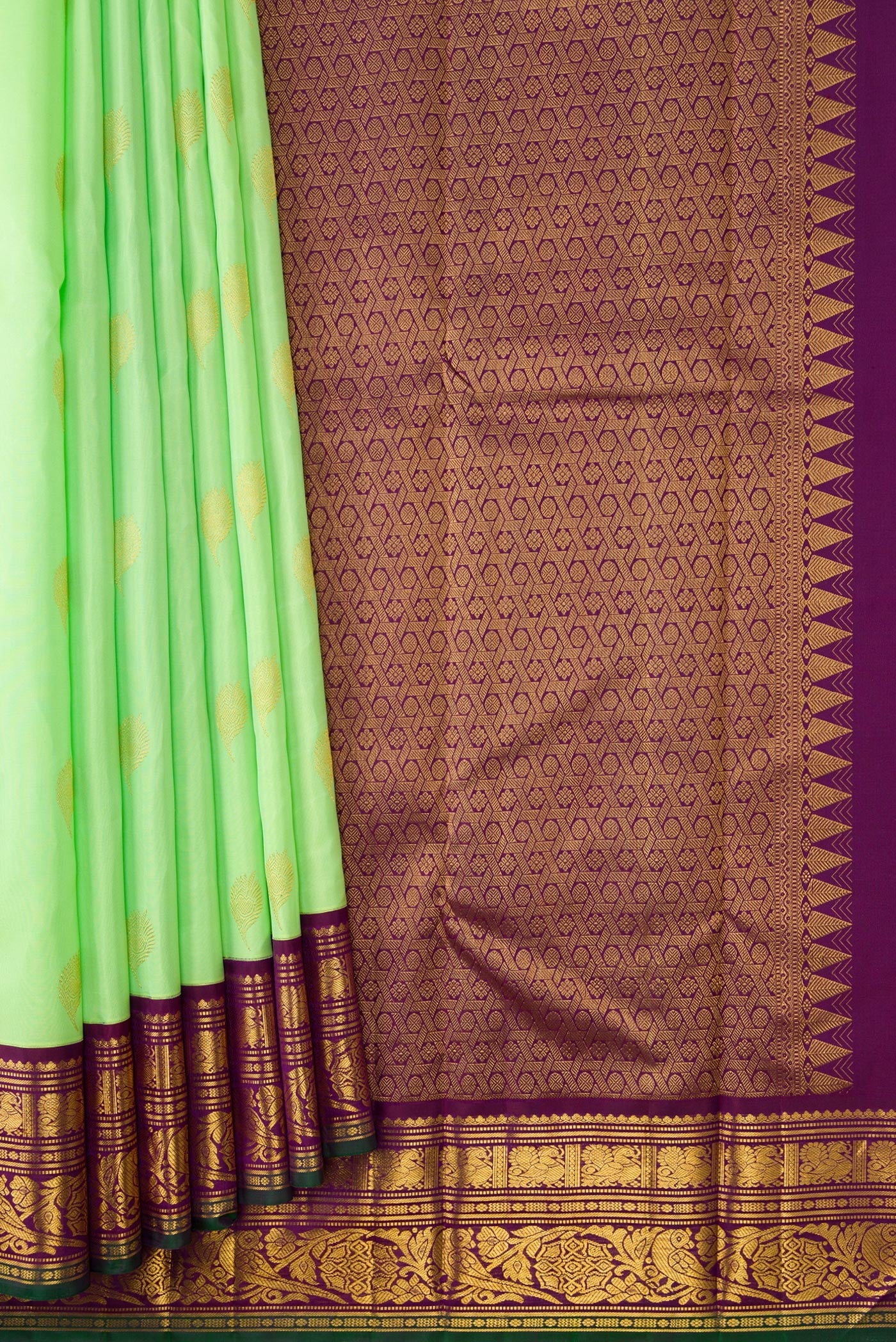 Pleats and pallu of Parrot Green Dual Tone Kanjivaram Silk Saree with Zari Butta on the body and Zari Border. 