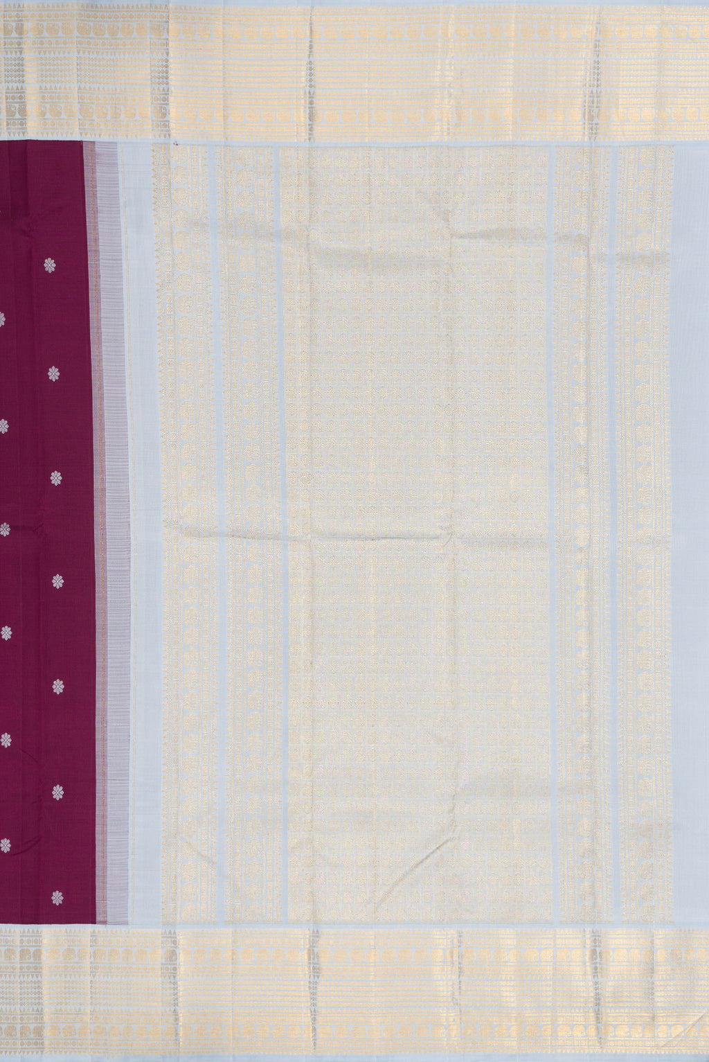 Close up image of the pallu of Pure Silk Pure Zari Brown Dual Tone Kanjivaram Saree with Thread Butta on the body and Zari Border. 