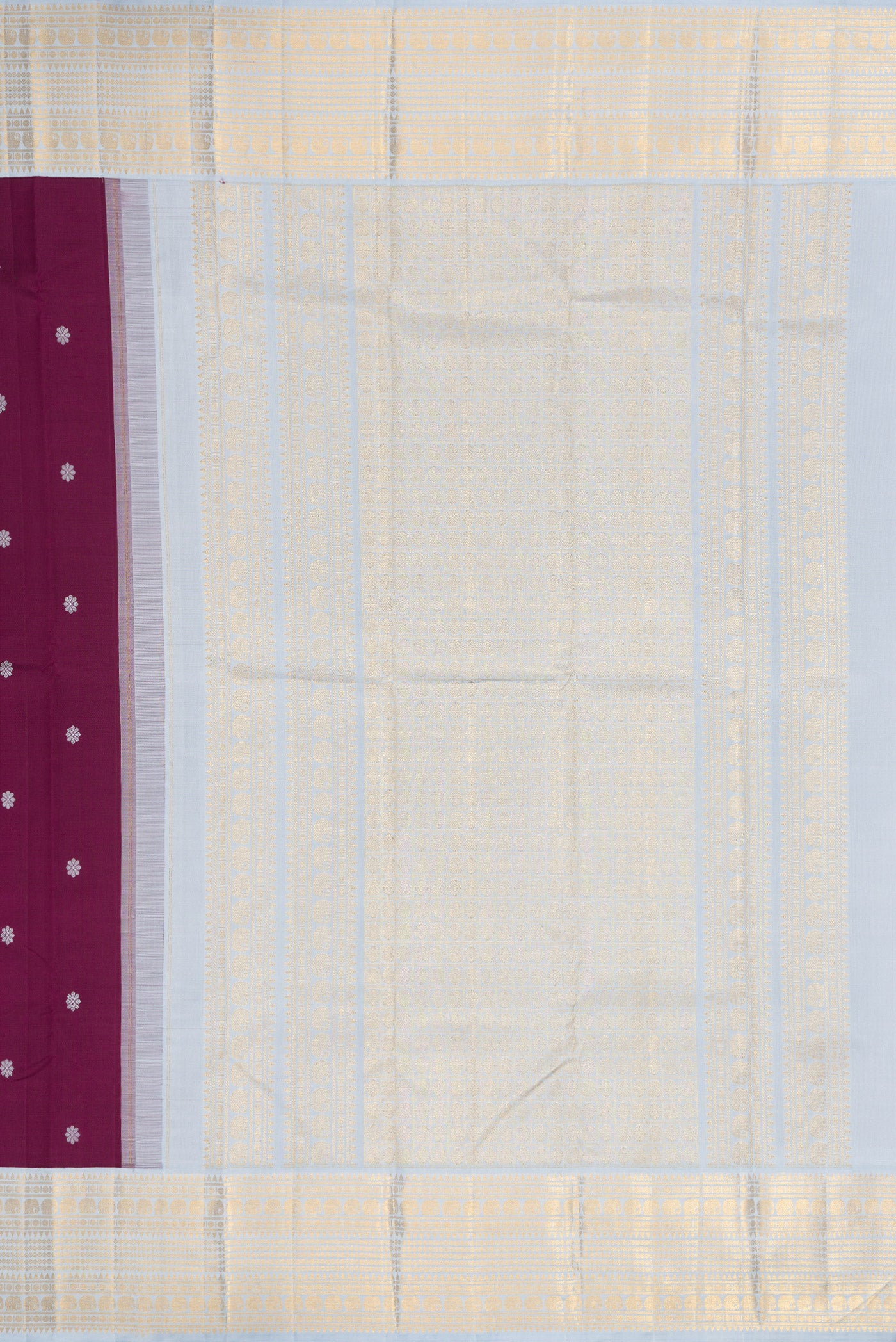 Close up image of the pallu of Pure Silk Pure Zari Brown Dual Tone Kanjivaram Saree with Thread Butta on the body and Zari Border. 