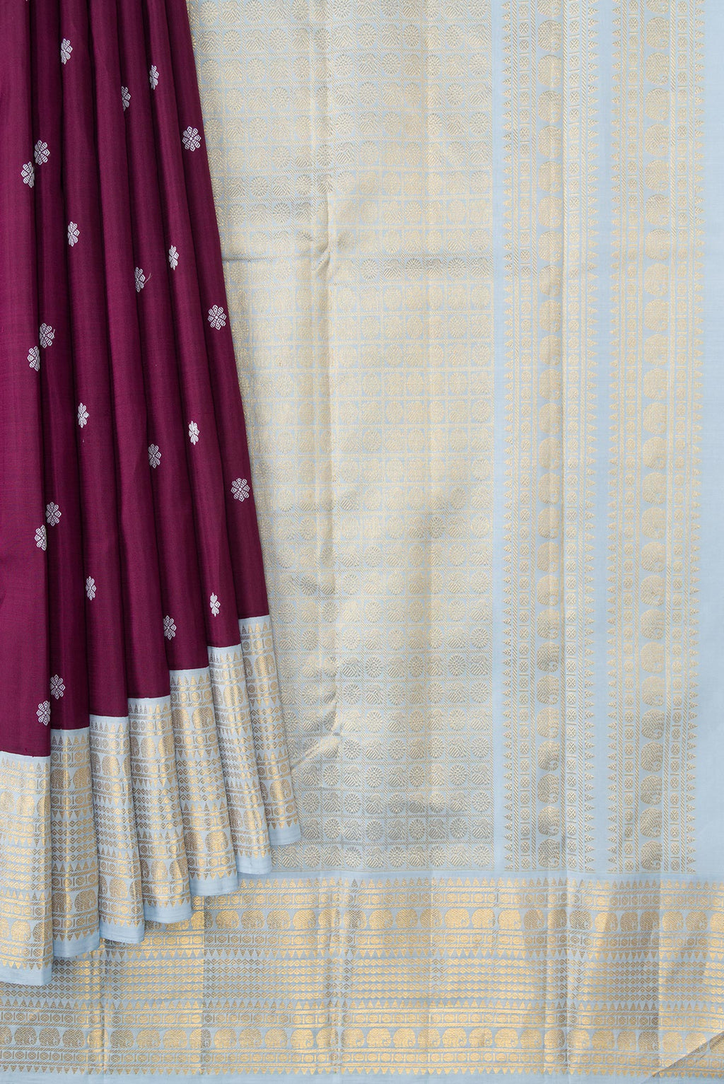Pleats and pallu of Pure Silk Pure Zari Brown Dual Tone Kanjivaram Saree with Thread Butta on the body and Zari Border. 