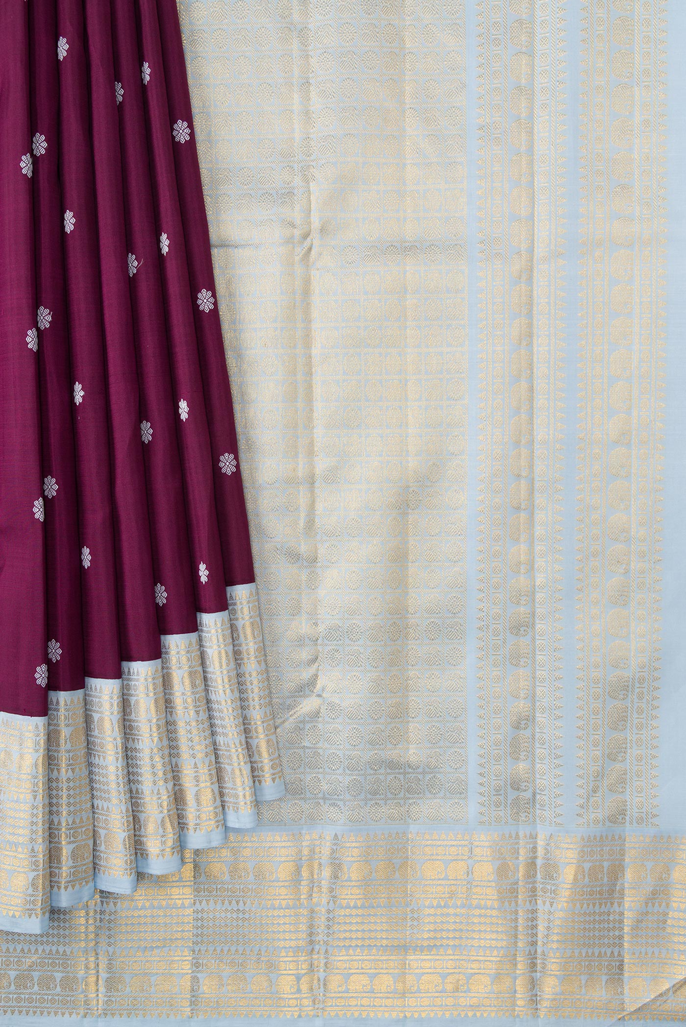 Pleats and pallu of Pure Silk Pure Zari Brown Dual Tone Kanjivaram Saree with Thread Butta on the body and Zari Border. 
