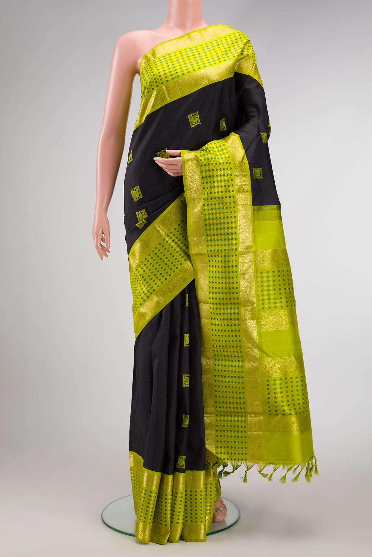 Black Dual Tone Kanjivaram Silk Saree with Thread Butta on the body and Fancy Border.  displayed on a mannequin