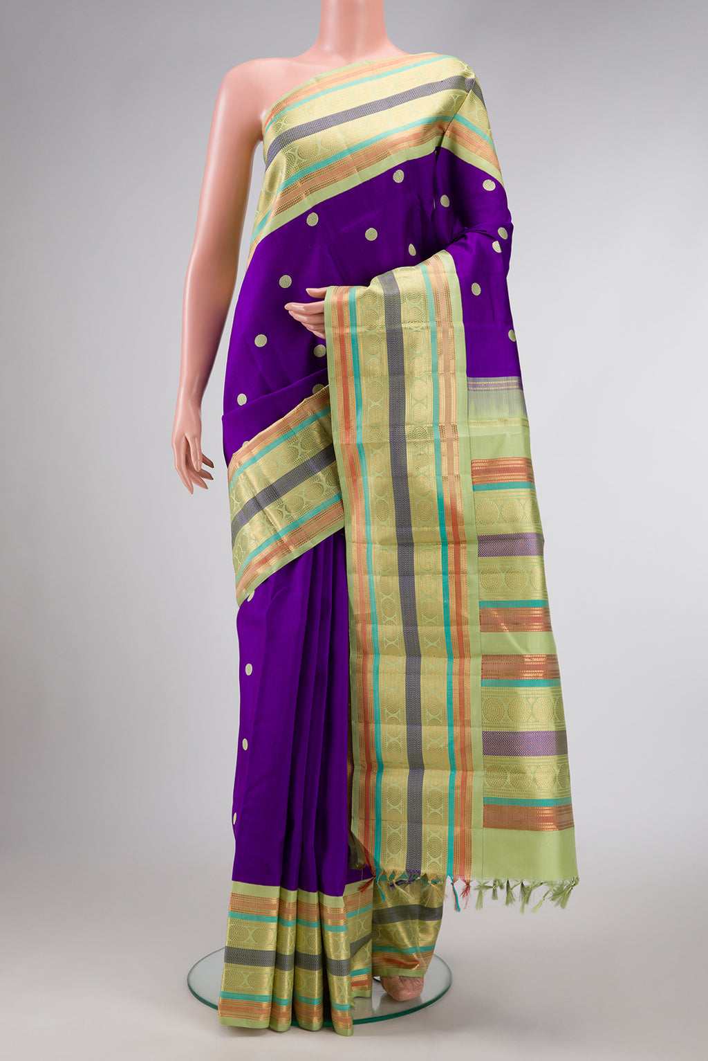 Violet Dual Tone Kanjivaram Silk Saree with Thread Butta on the body and Zari And Thread Border.  displayed on a mannequin