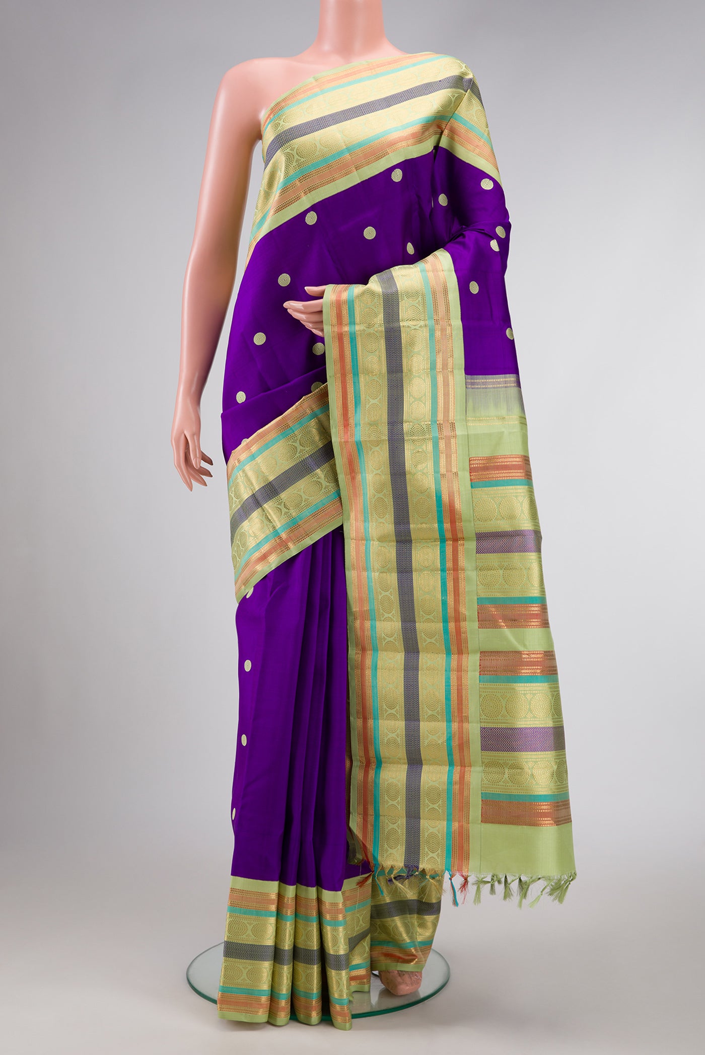 Violet Dual Tone Kanjivaram Silk Saree with Thread Butta on the body and Zari And Thread Border.  displayed on a mannequin