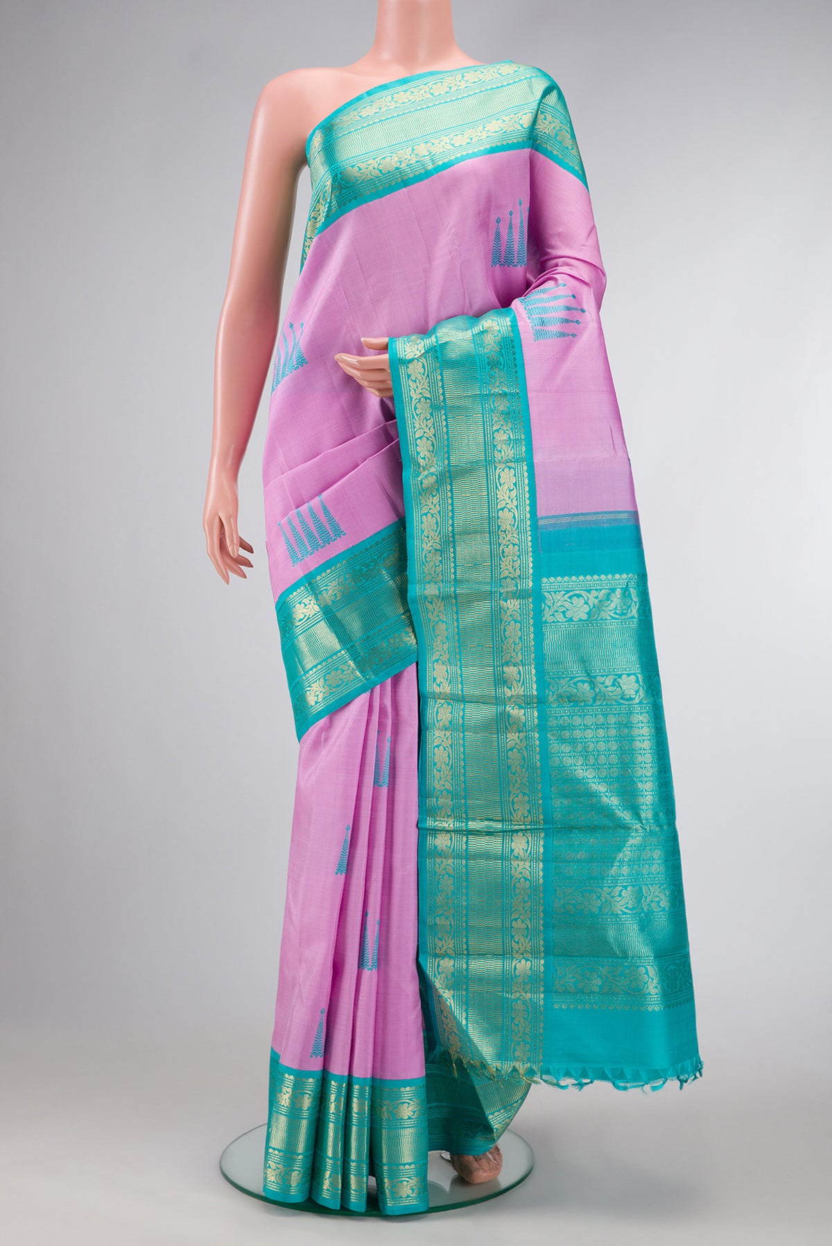 Pure Silk Pure Zari Pink Dual Tone Kanjivaram Saree with Thread Butta on the body and Zari Border.  displayed on a mannequin