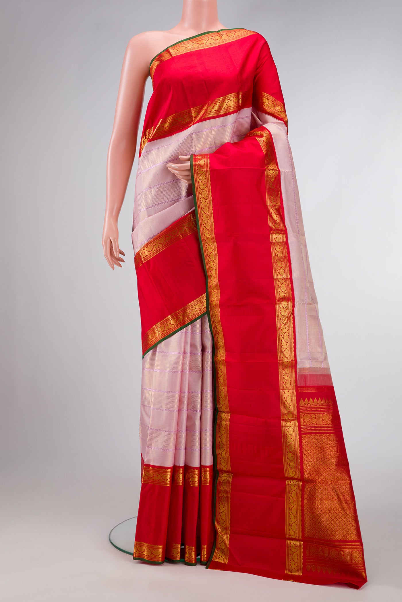 Pink Dual Tone Kanchipuram Silk Saree with Checked design on the body and Zari Border.  displayed on a mannequin