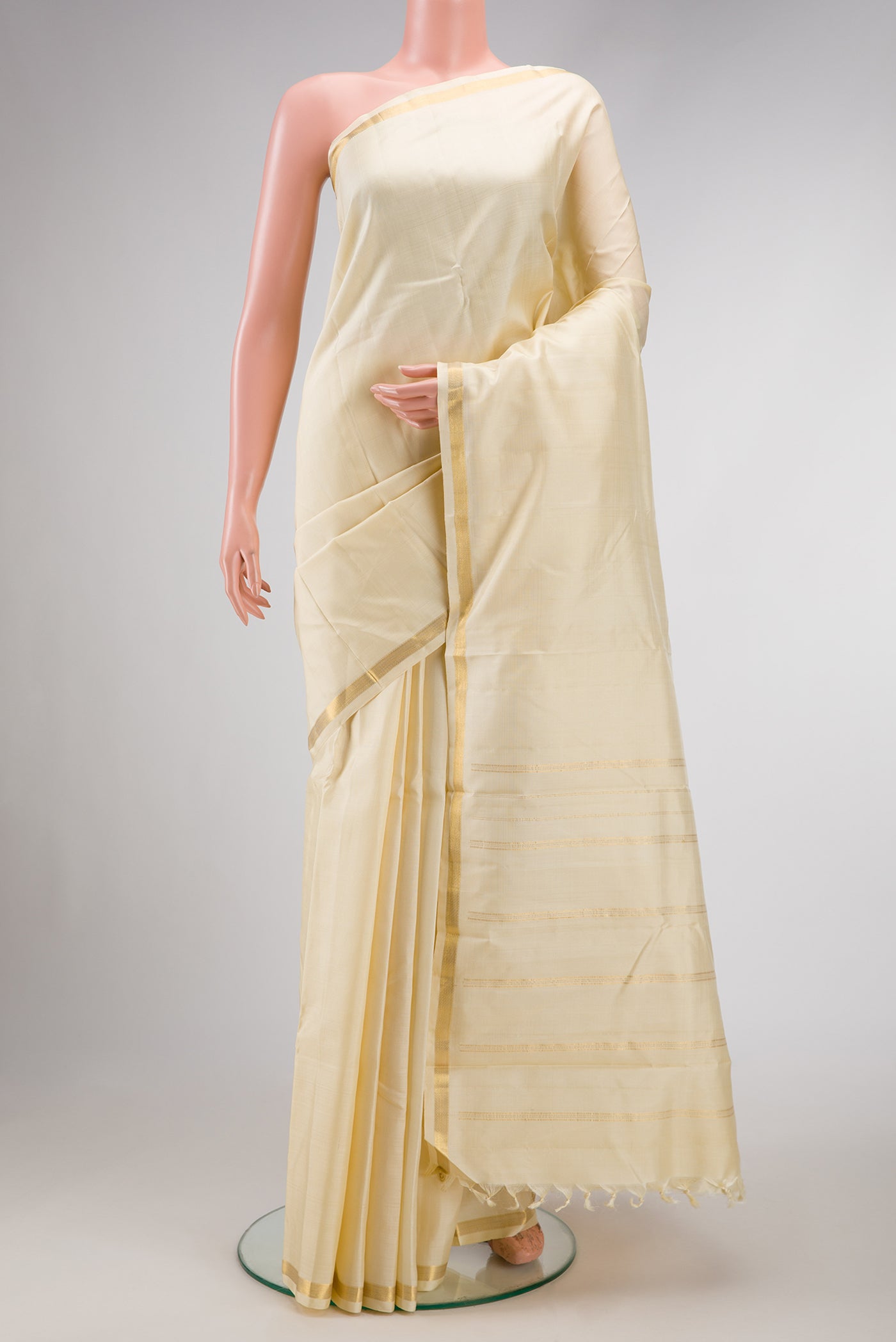 Off White Dual Tone Kanjivaram Silk Saree with Plain Body and Zari Border.  displayed on a mannequin