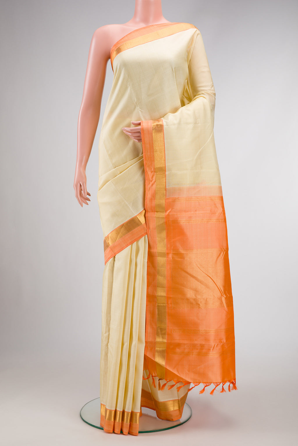 Sandal Dual Tone Kanjivaram Silk Saree with Plain Body and Zari Border.  displayed on a mannequin
