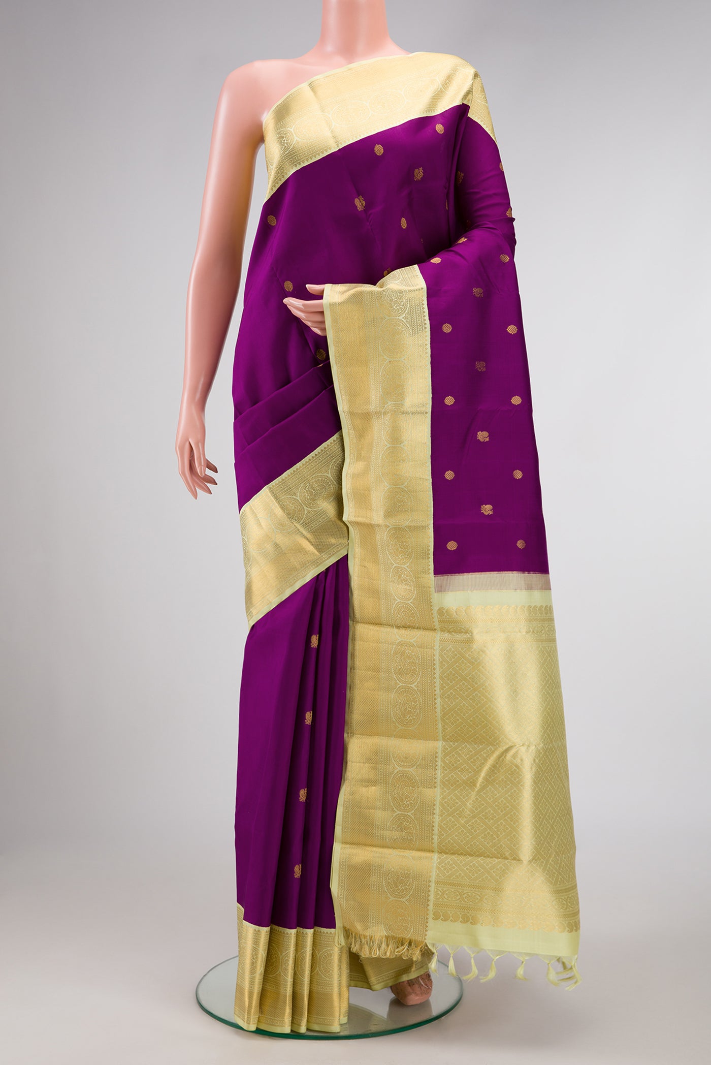 Purple Dual Tone Kanjivaram Silk Saree with Zari Butta on the body and Zari Border.  displayed on a mannequin