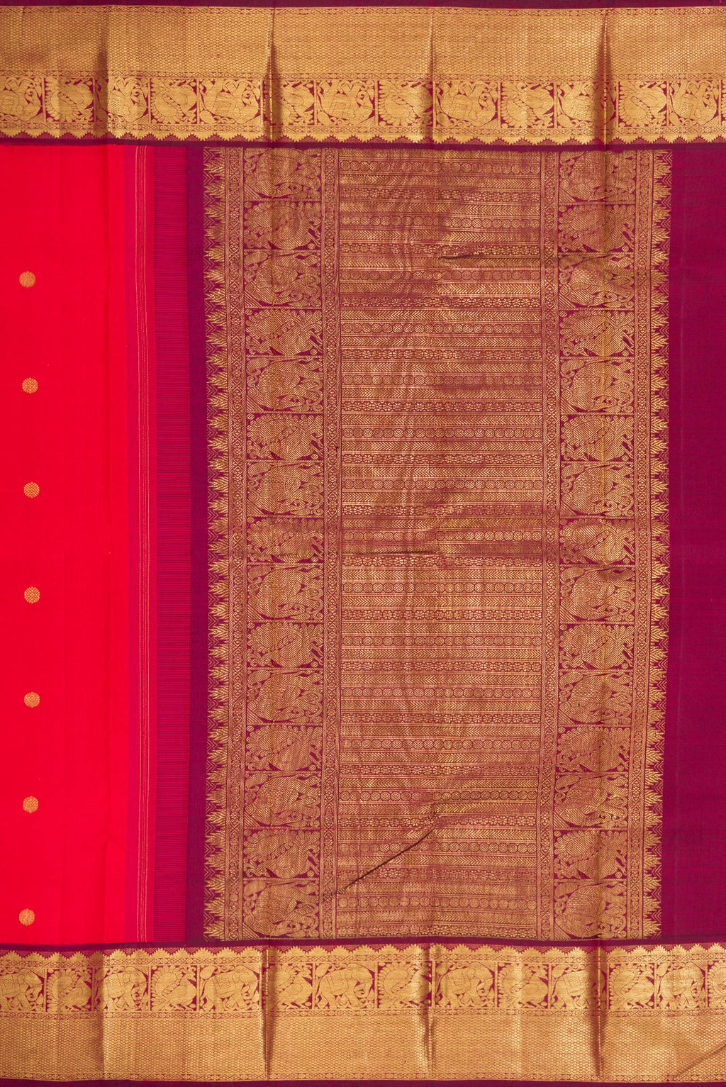 Close up image of the pallu of Red Dual Tone Kanjivaram Silk Saree with Zari Butta on the body and Zari Border. 