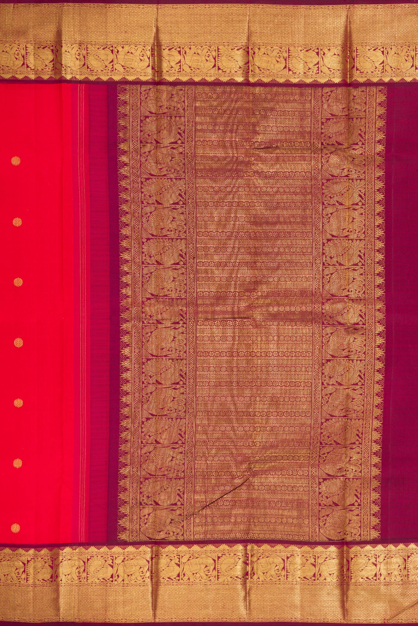 Close up image of the pallu of Red Dual Tone Kanjivaram Silk Saree with Zari Butta on the body and Zari Border. 