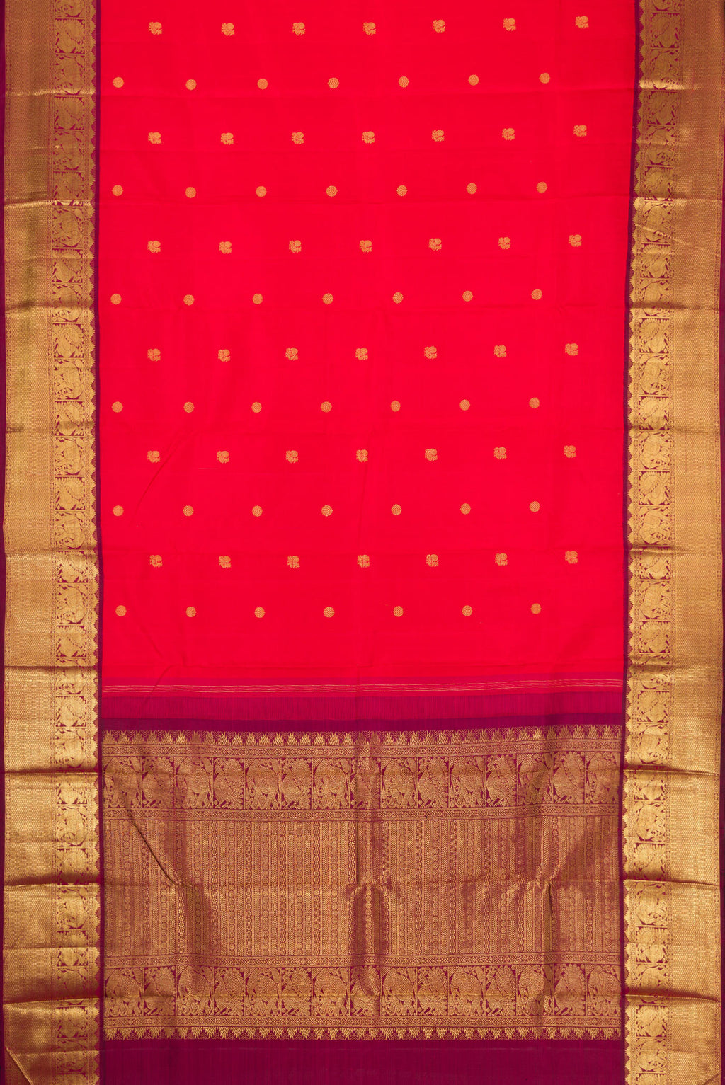Flat view of Red Dual Tone Kanjivaram Silk Saree with Zari Butta on the body and Zari Border. 