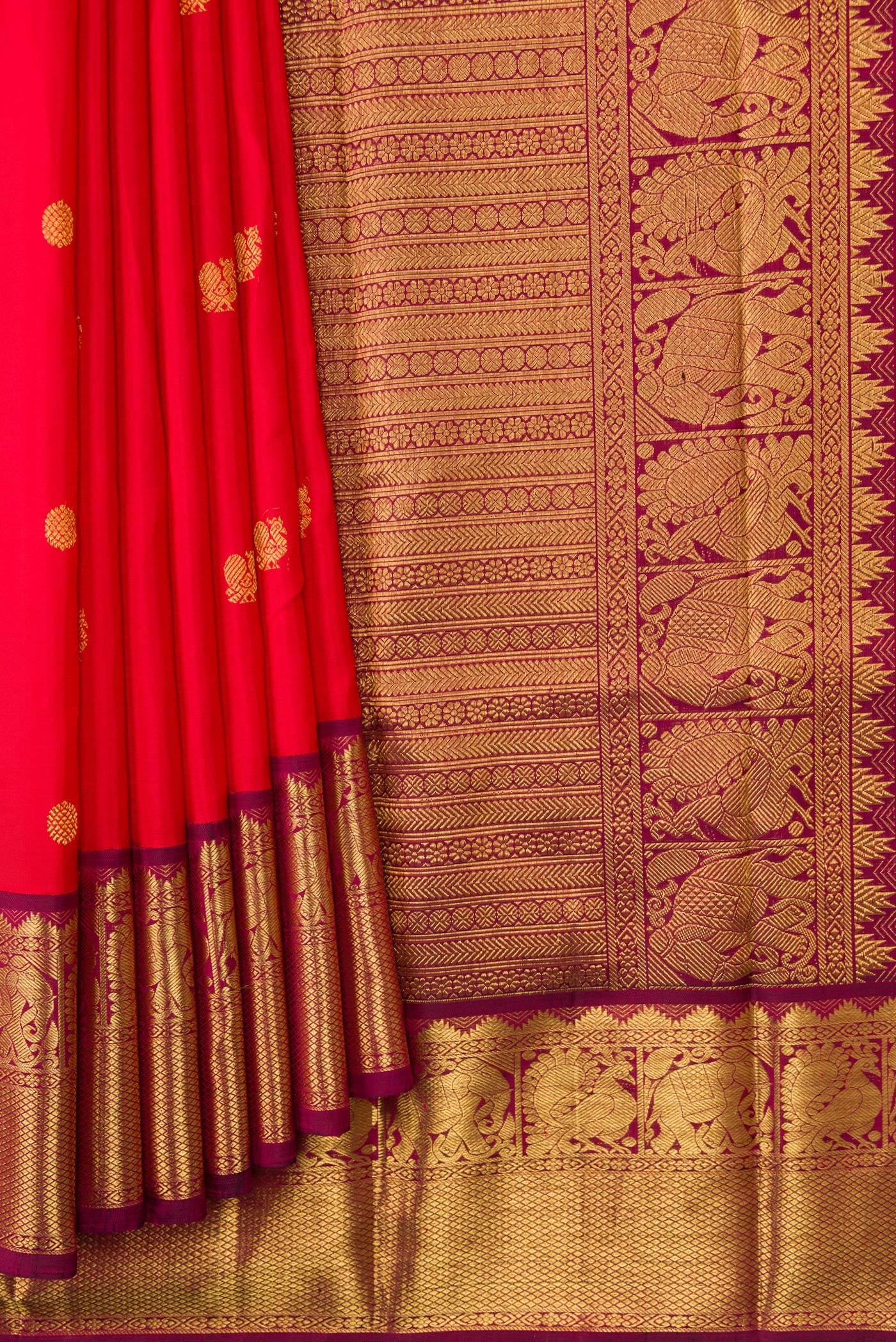 Pleats and pallu of Red Dual Tone Kanjivaram Silk Saree with Zari Butta on the body and Zari Border. 