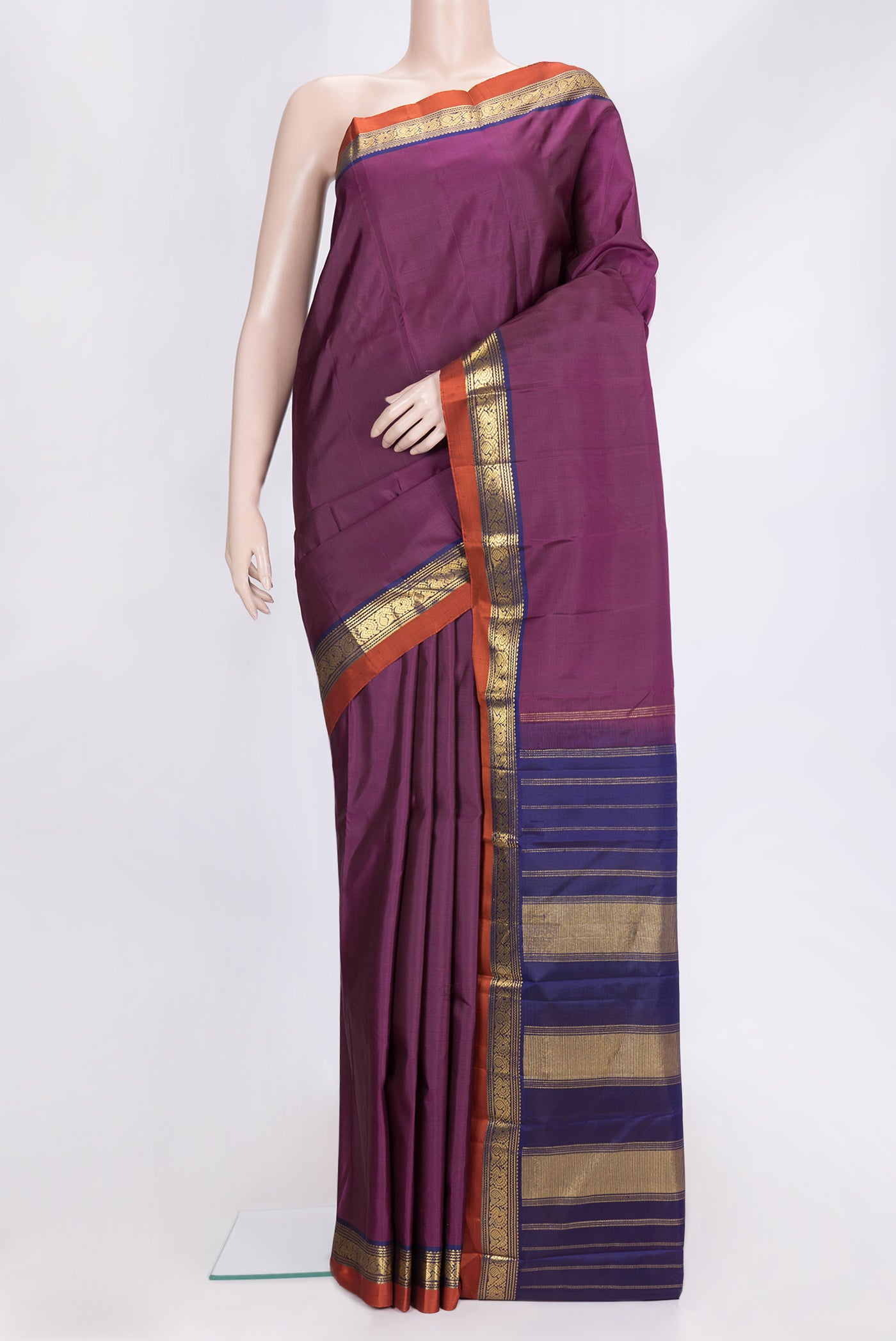 Magenta Dual Tone Kanjivaram Silk Saree with Plain Body and Zari Border.  displayed on a mannequin