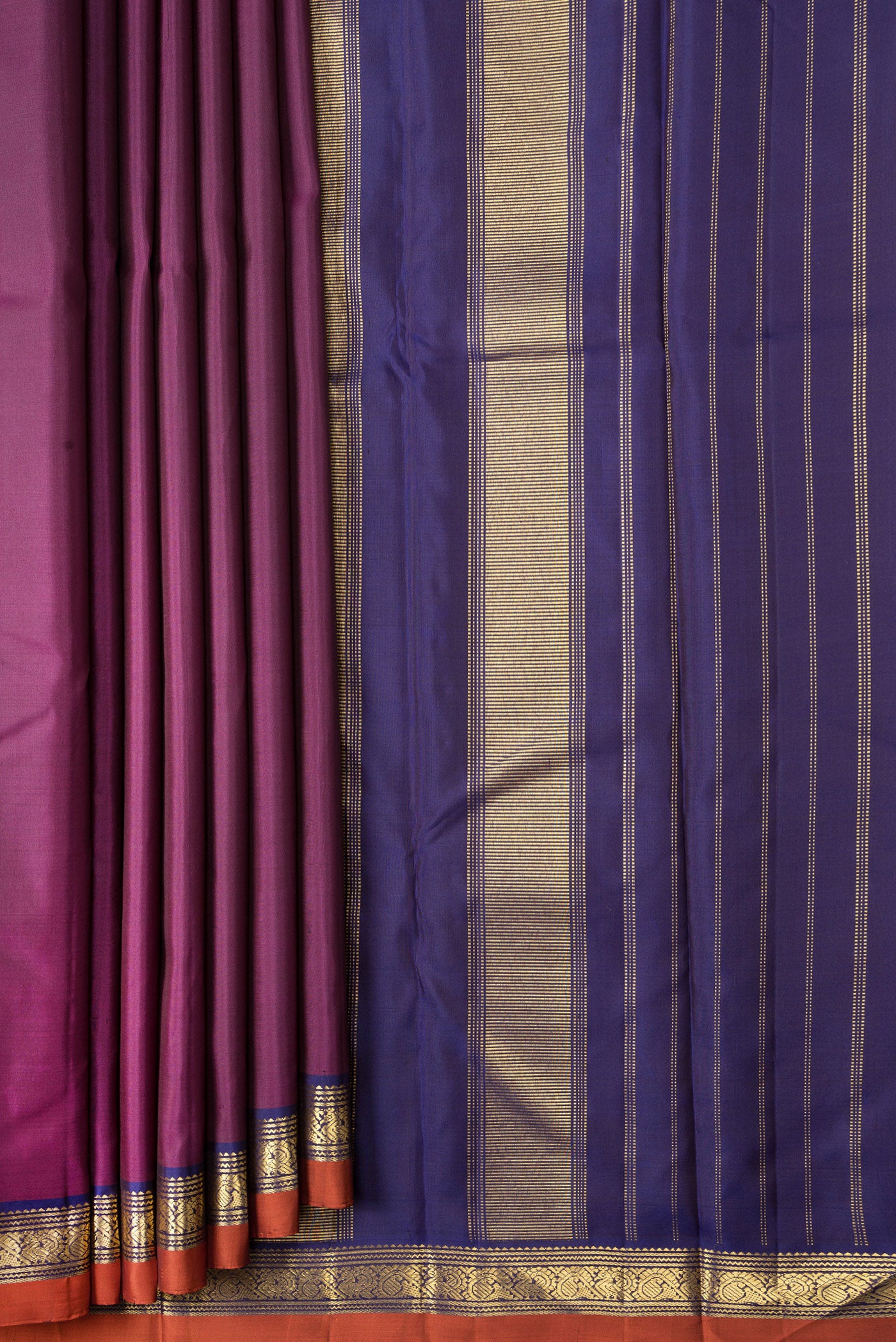 Pleats and pallu of Magenta Dual Tone Kanjivaram Silk Saree with Plain Body and Zari Border. 
