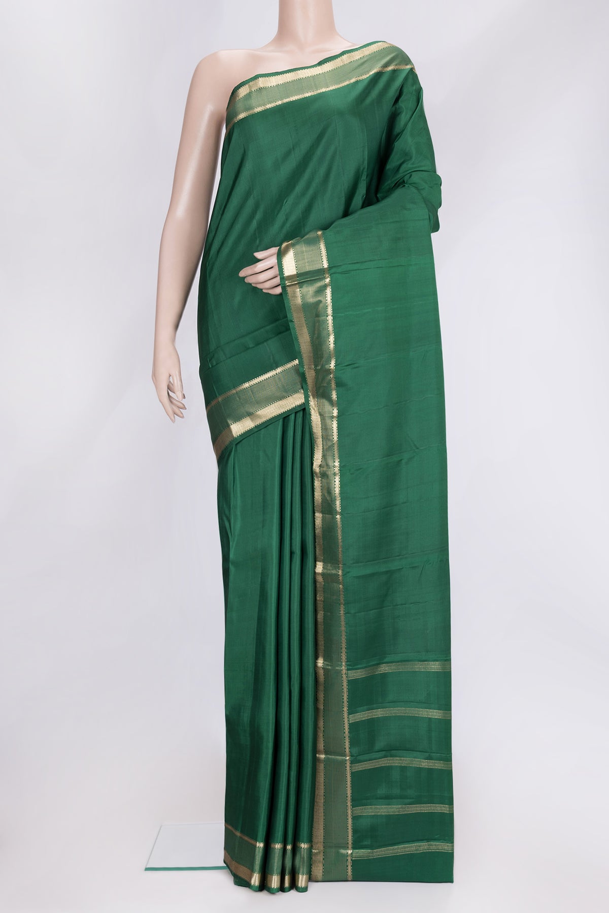 Bottle Green Dual Tone Kanjivaram Silk Saree with Plain Body and Zari Border.  displayed on a mannequin