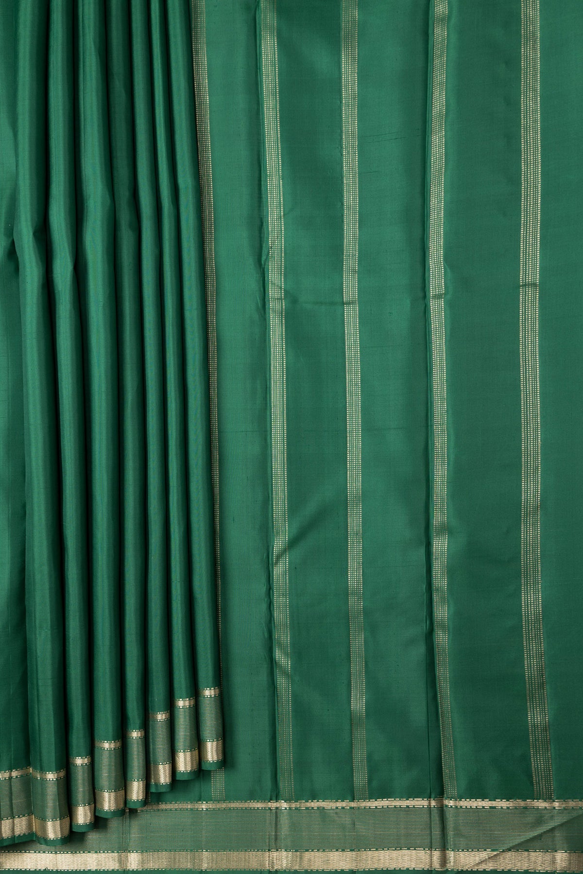 Pleats and pallu of Bottle Green Dual Tone Kanjivaram Silk Saree with Plain Body and Zari Border. 