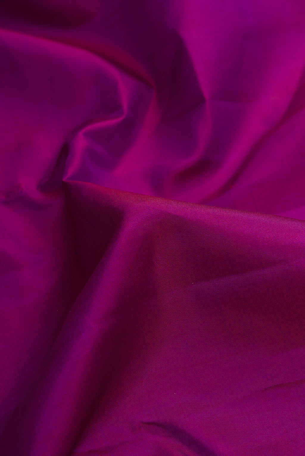 Close up of Pure Silk Pure Zari Purple Dual Tone Kanjivaram Saree with Plain Body and Zari Border.  displaying folds