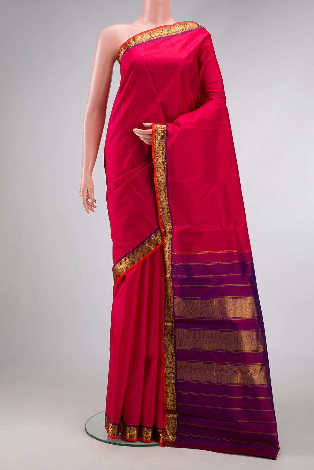 Dark Pink Dual Tone Kanjivaram Silk Saree with Plain Body and Zari Border.  displayed on a mannequin