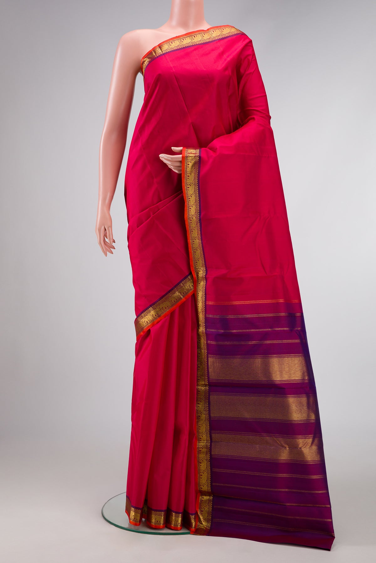 Dark Pink Dual Tone Kanjivaram Silk Saree with Plain Body and Zari Border.  displayed on a mannequin