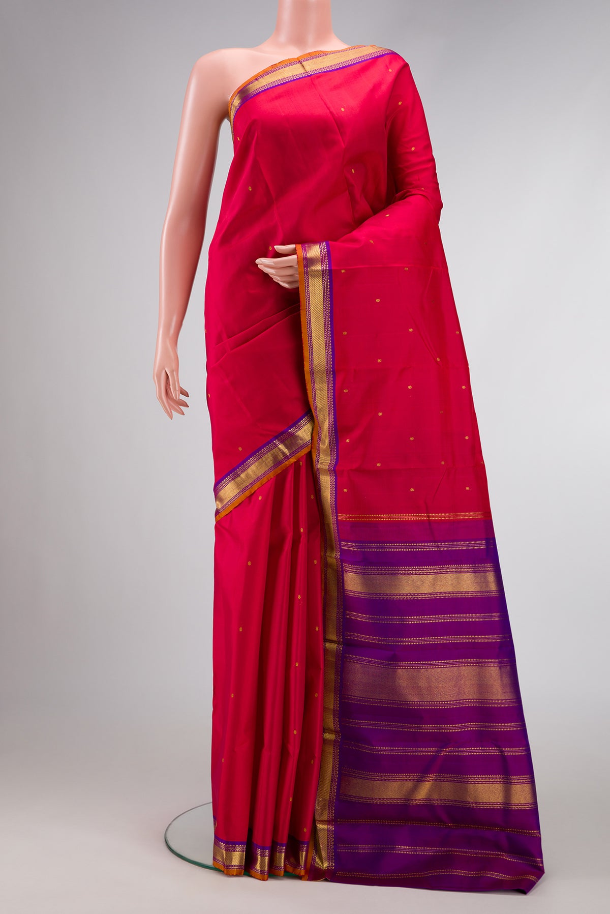 Red Dual Tone Kanchipuram Silk Saree with Zari Butta on the body and Zari Border.  displayed on a mannequin