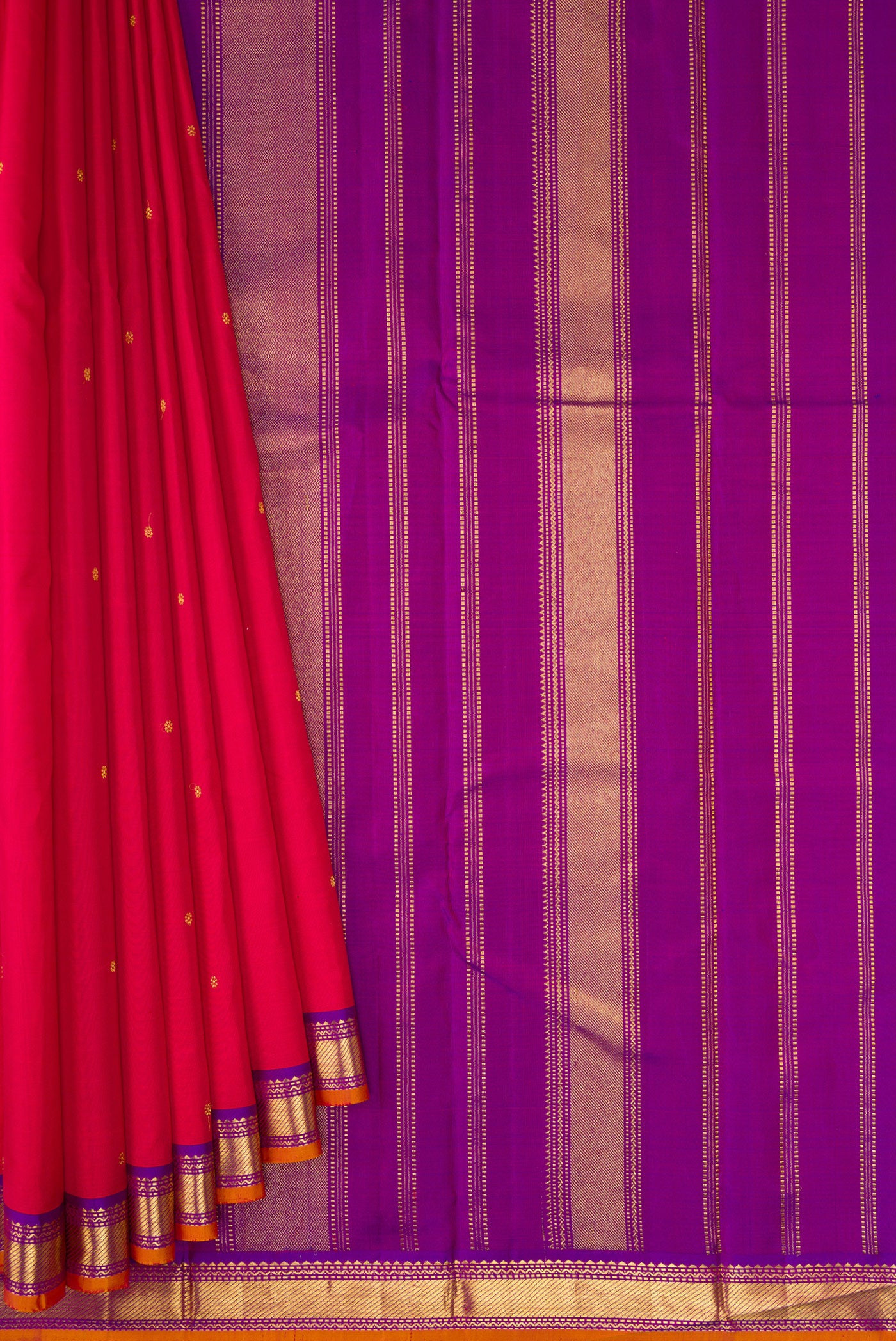 Pleats and pallu of Red Dual Tone Kanchipuram Silk Saree with Zari Butta on the body and Zari Border. 
