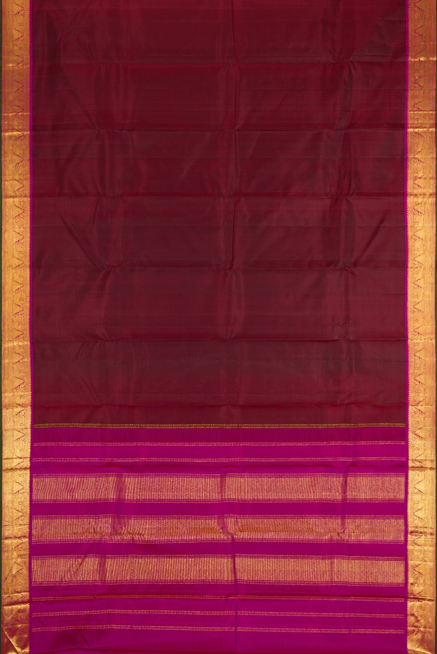 Flat view of Maroon Dual Tone Kanchipuram Silk Saree with Plain Body and Zari Border. 