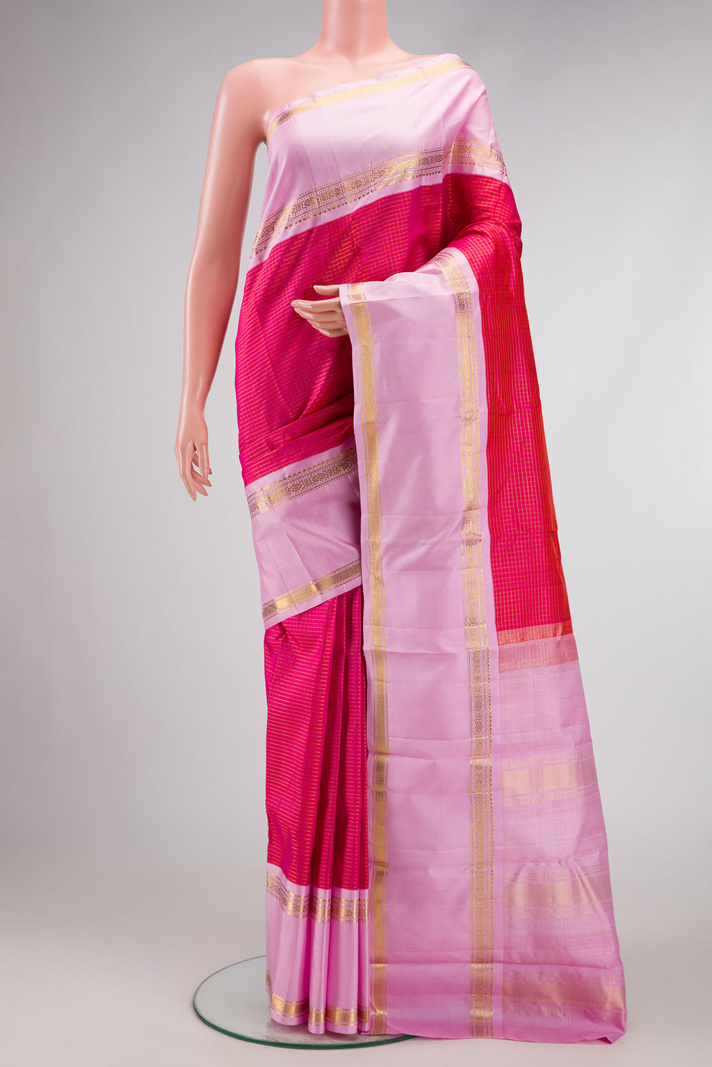 Pink Dual Tone Kanjivaram Silk Saree with Checked design on the body and Zari Border.  displayed on a mannequin
